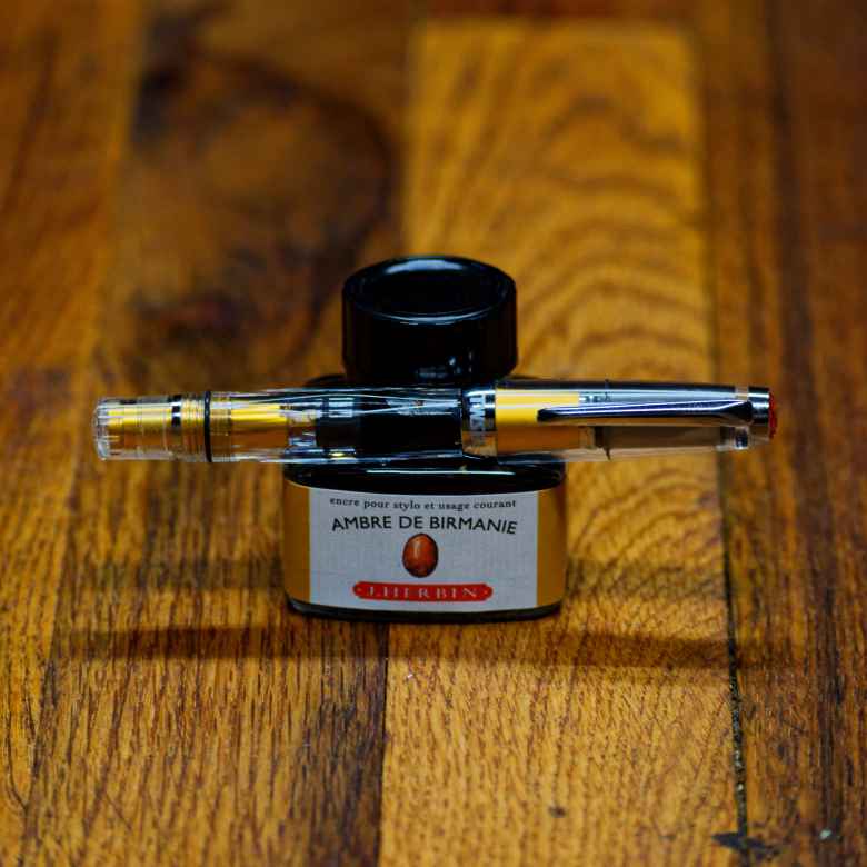 Gold TWSBI Diamond Mini AL (IF) filled with J. Herbin Ambre de Birmanie