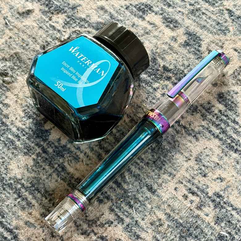 Iris TWSBI Vac 700R Extra Fine filled with Waterman Inspired Blue