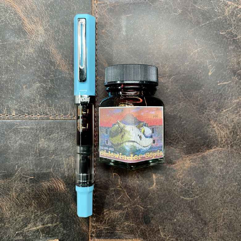 Sky Blue TWSBI Eco (Extra Fine) filled with Noodler's Texas Sidewinder