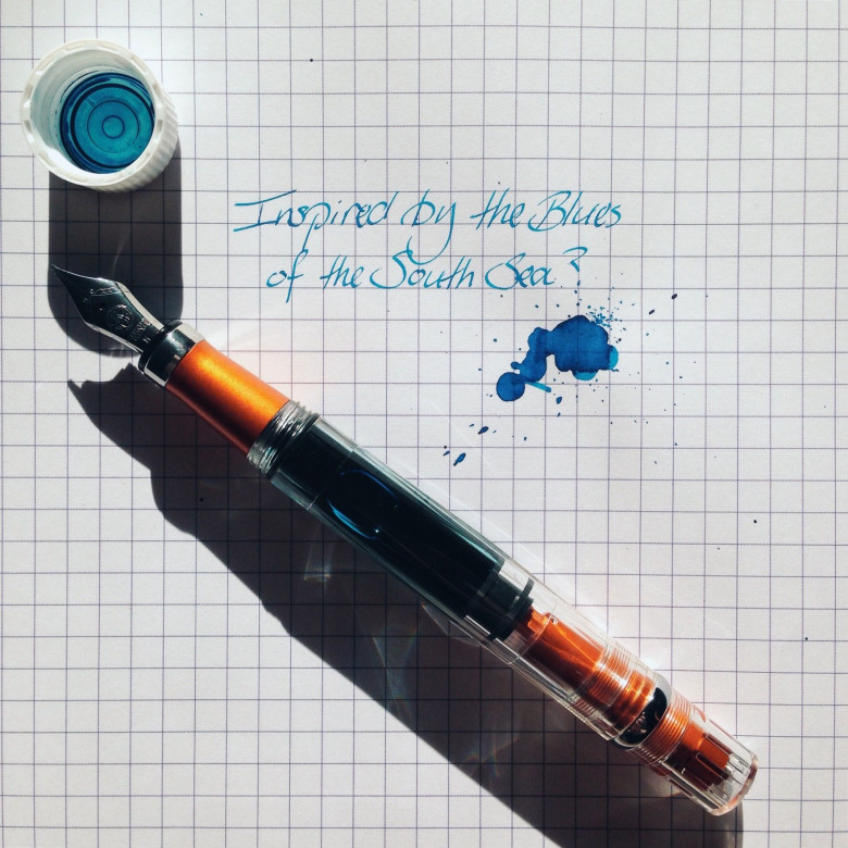 Orange TWSBI Diamond 580AL (IM) filled with Waterman Inspired Blue