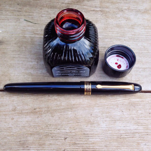 Black Italix Parson's Essential 0.65mm CI filled with Diamine Red Dragon